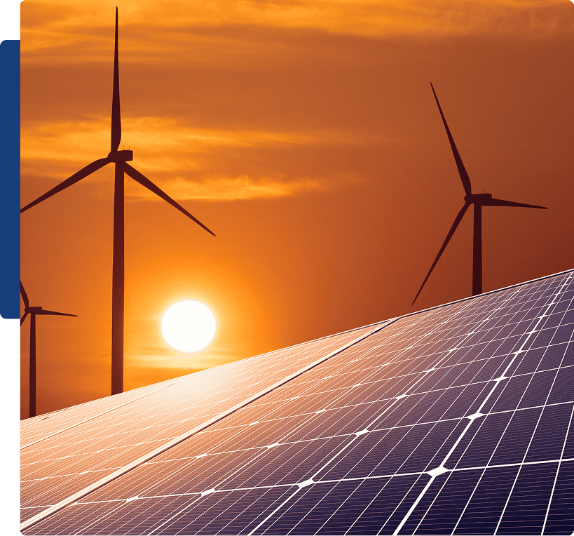 Solar panels and wind turbines at sunset.